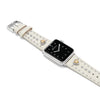 Smartwatch with a decorative white strap featuring heart and star designs on a white background